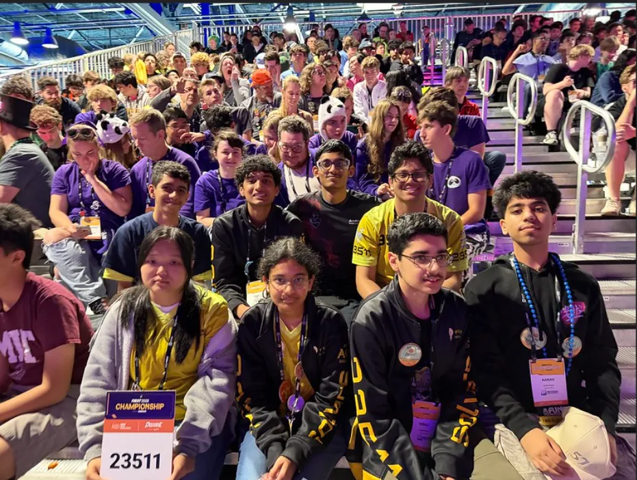 Seattle Solvers members in the stands at the World Championship, one holding a 23511 team sign