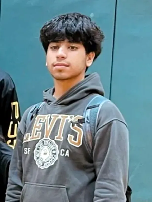 Aarav in a grey hoodie