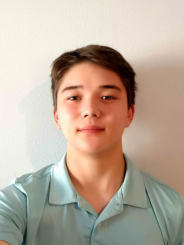 Brandon in a light blue polo shirt
