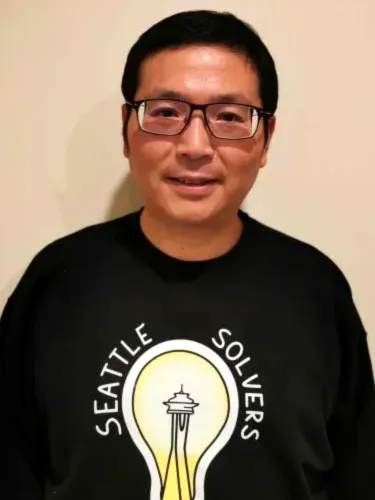 Zheng in a Seattle Solvers t-shirt