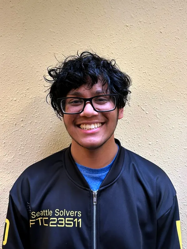 Ishaan in the team jacket