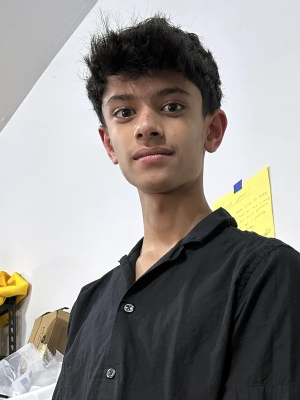 Kabir in a black button-up shirt