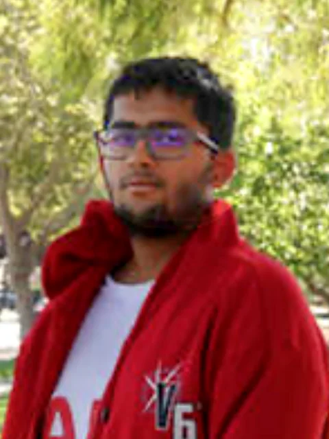 Aarsh in a red jacket outdoors