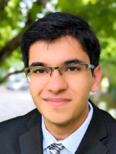 Sanchit in a suit and tie
