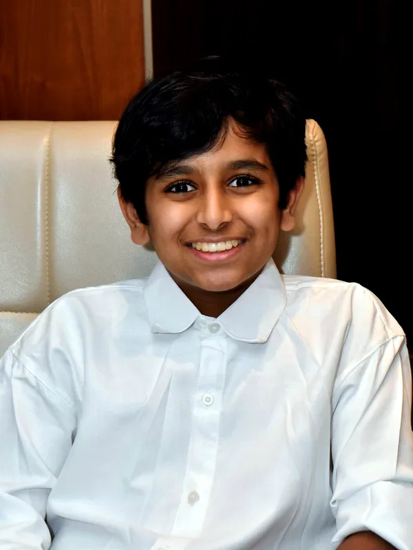 Uthkarsh in a white shirt